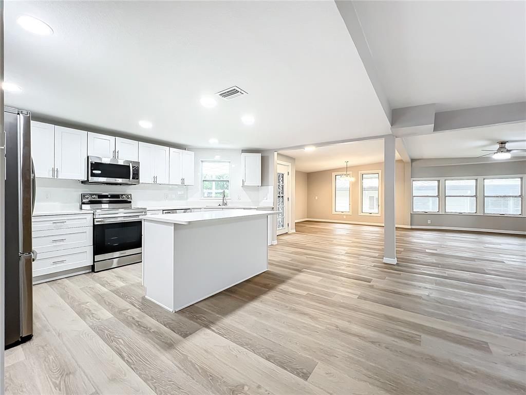 Interior, Kitchen, Pendant Lights, Recessed Lighting, Stainless Steel Appliances, Wood Texture Flooring