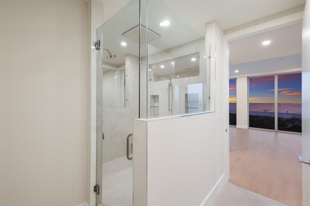 Bathroom, Glass Shower, Interior, Marble Walls, Recessed Lighting, Water, Wood Texture Flooring
