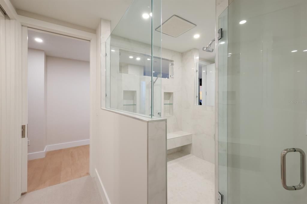 Bathroom, Glass Shower, Interior, Marble Walls, Recessed Lighting, Wood Texture Flooring