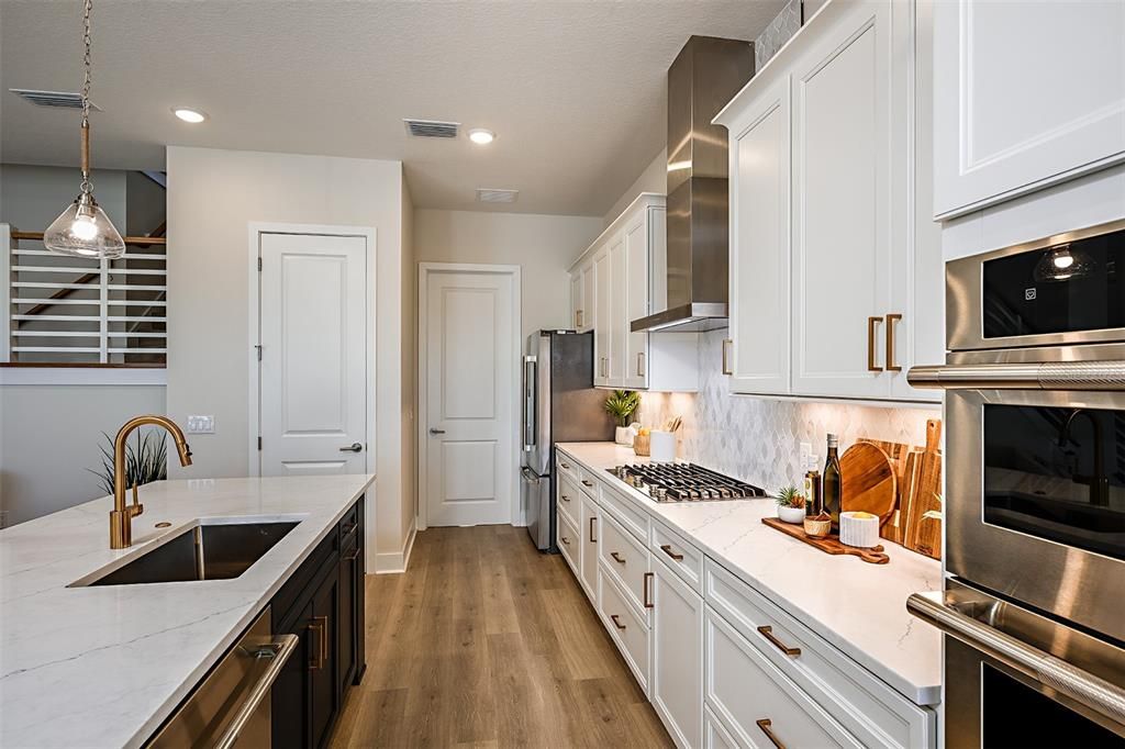 Interior, Kitchen, Pendant Lights, Recessed Lighting, Stainless Steel Appliances, Wood Texture Flooring