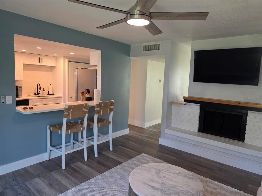 Fireplace, Interior, Kitchen, Recessed Lighting, Wood Texture Flooring