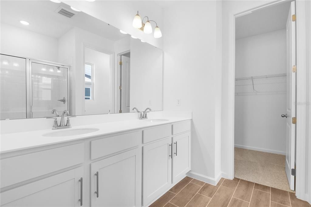 Bathroom, Dual Sink Vanities, Glass Shower, Interior, Recessed Lighting, Walk-in Closets, Wood Texture Flooring