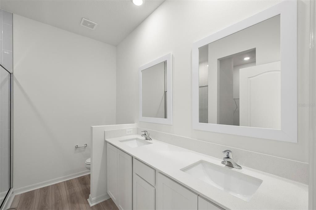 Bathroom, Dual Sink Vanities, Interior, Recessed Lighting, Wood Texture Flooring