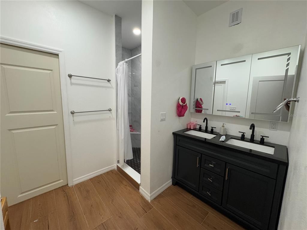 Bathroom, Dual Sink Vanities, Interior, Recessed Lighting, Wood Texture Flooring