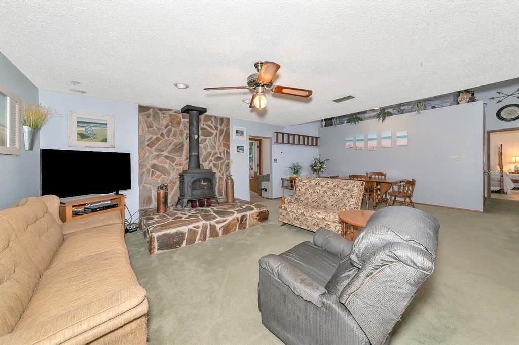 Dining room, Fireplace, Interior, Living room, Recessed Lighting, Stone Walls