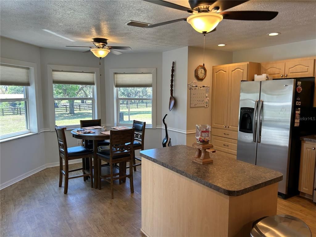 Dining room, Interior, Kitchen, Recessed Lighting, Stainless Steel Appliances, Wood Texture Flooring
