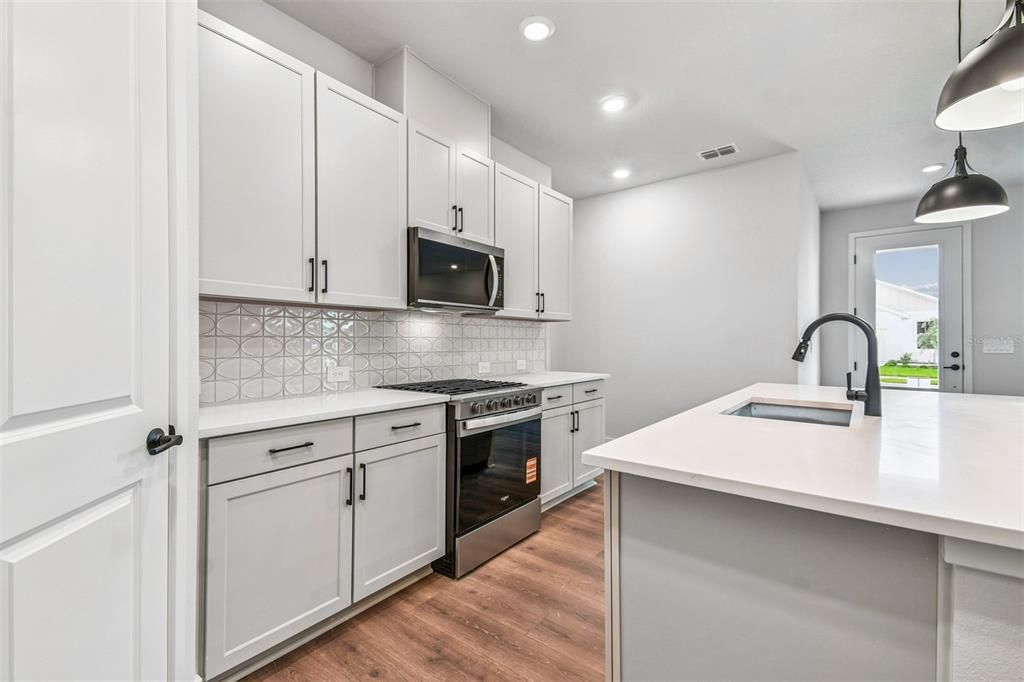 Interior, Kitchen, Pendant Lights, Recessed Lighting, Stainless Steel Appliances, Wood Texture Flooring