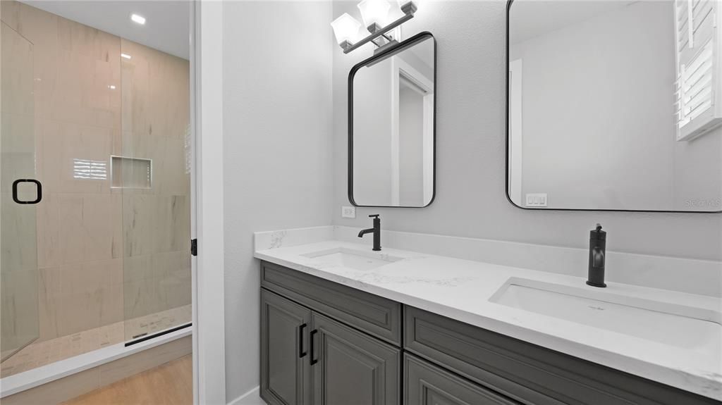 Bathroom, Dual Sink Vanities, Glass Shower, Interior, Recessed Lighting, Wood Texture Flooring