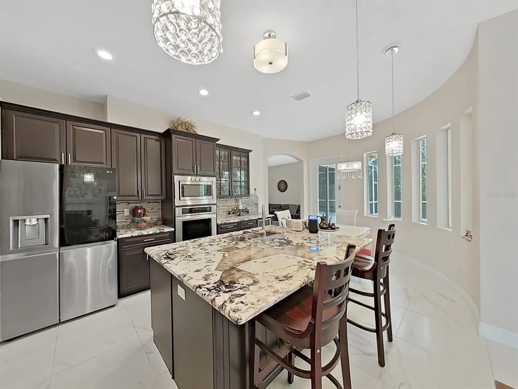 Chandelier, Dining room, Interior, Kitchen, Pendant Lights, Recessed Lighting, Stainless Steel Appliances