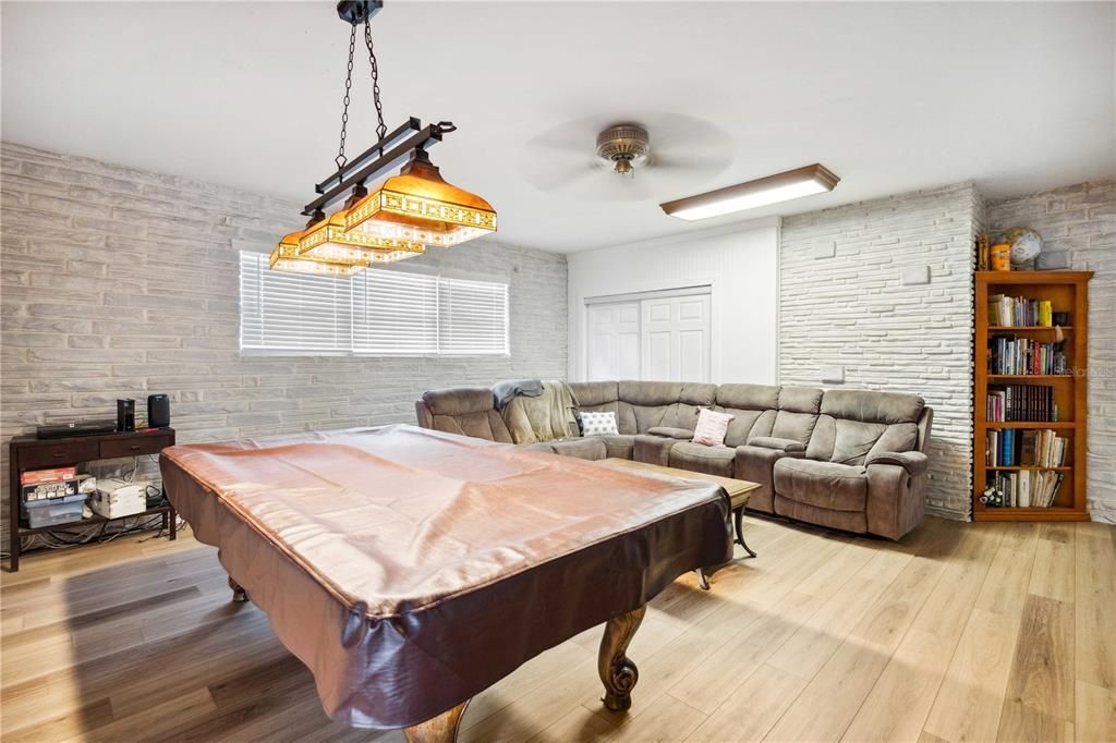 Billiard Table, Game Room, Interior, Living room, Pendant Lights, Stone Walls, Wood Texture Flooring