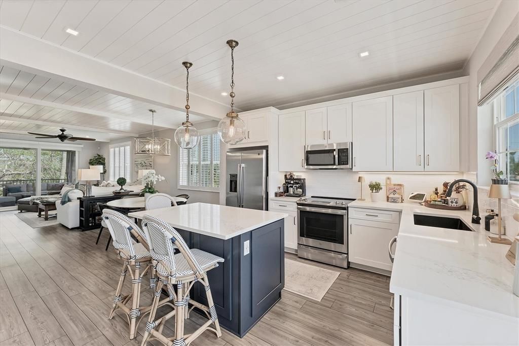 Dining room, Interior, Kitchen, Living room, Pendant Lights, Recessed Lighting, Stainless Steel Appliances, Wood Texture Flooring