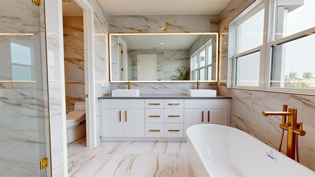 Bathroom, Dual Sink Vanities, Free Standing Baths, Glass Shower, Interior, Marble, Marble Walls, Recessed Lighting