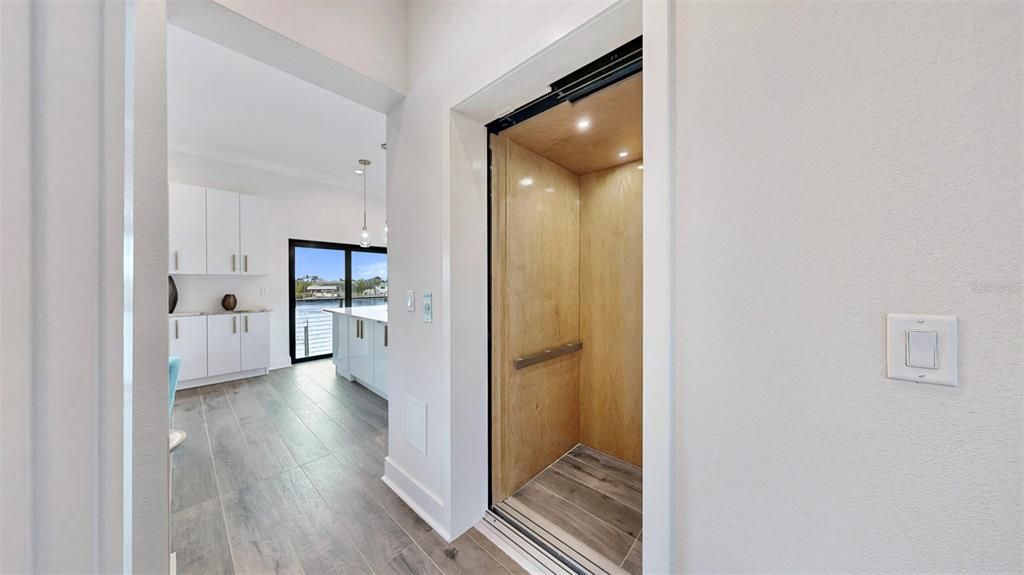 Elevator, Interior, Pendant Lights, Recessed Lighting, Wooden Ceilings, Wood Texture Flooring, Wooden Walls