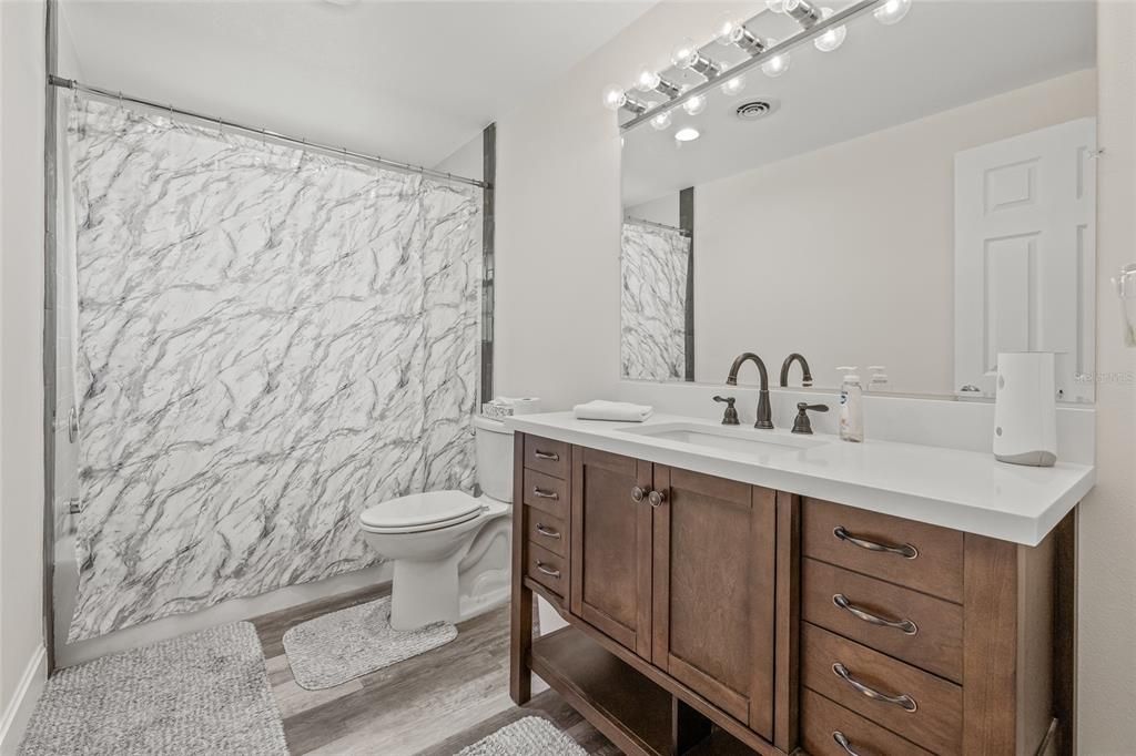Bathroom, Dual Sink Vanities, Interior, Marble Walls, Wood Texture Flooring