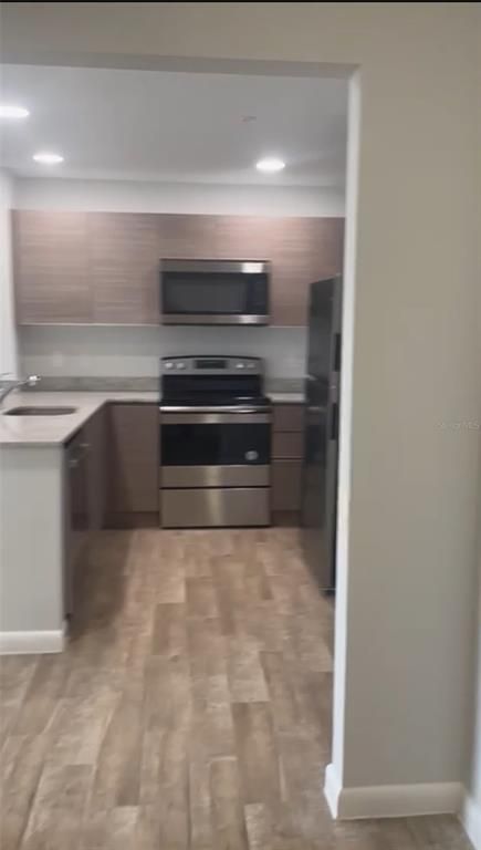 Interior, Kitchen, Recessed Lighting, Stainless Steel Appliances, Wood Texture Flooring