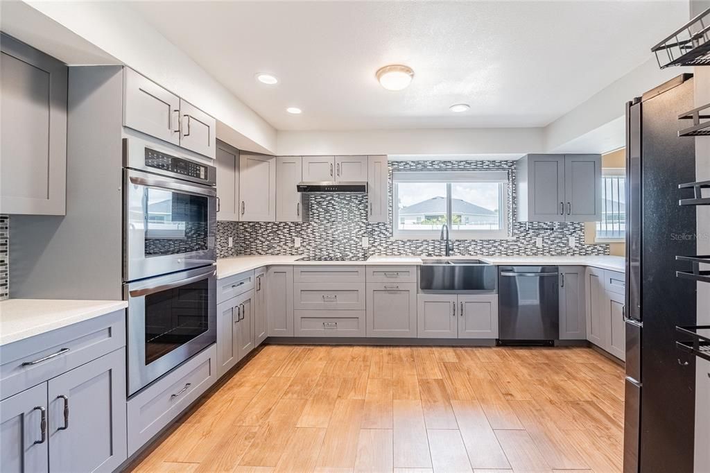 Interior, Kitchen, Recessed Lighting, Stainless Steel Appliances, Wood Texture Flooring