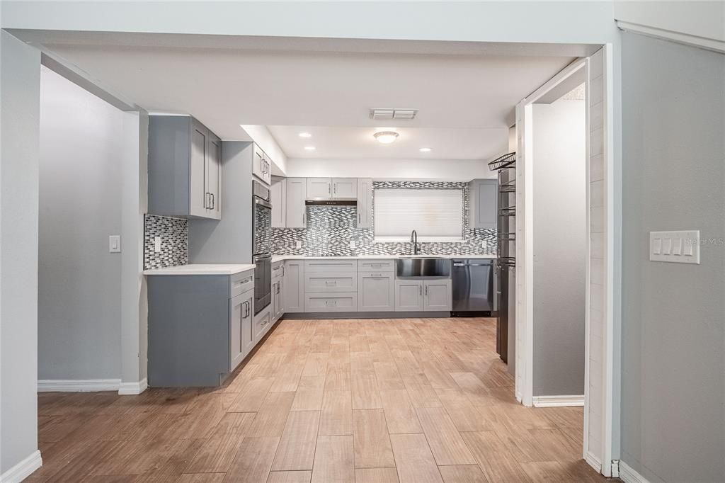 Interior, Kitchen, Recessed Lighting, Stainless Steel Appliances, Wood Texture Flooring