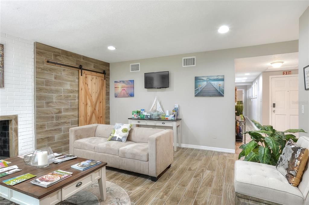 Fireplace, Interior, Living room, Recessed Lighting, Stone Walls, Wood Texture Flooring, Wooden Walls