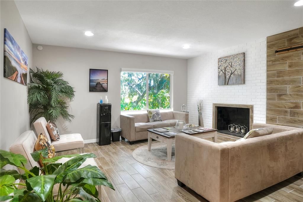 Fireplace, Interior, Living room, Recessed Lighting, Stone Walls, Wood Texture Flooring