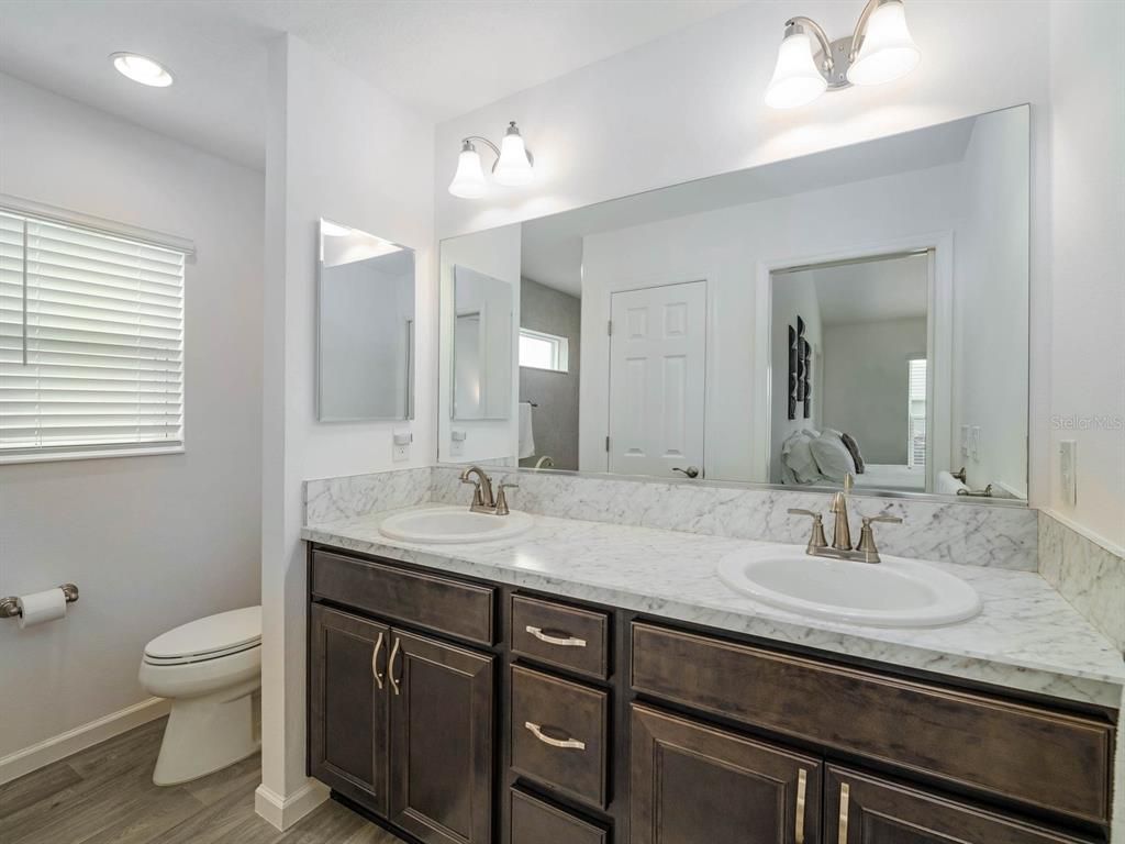 Bathroom, Dual Sink Vanities, Interior, Recessed Lighting, Wood Texture Flooring