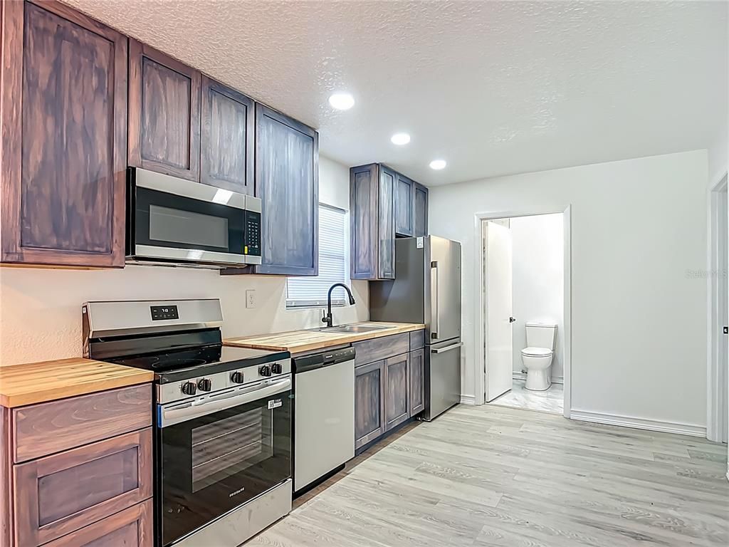 Interior, Kitchen, Recessed Lighting, Stainless Steel Appliances, Wood Texture Flooring