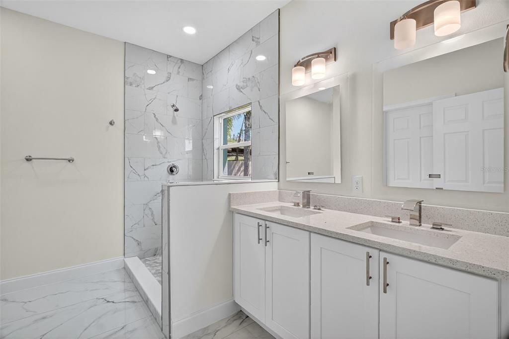 Bathroom, Dual Sink Vanities, Glass Shower, Interior, Marble, Marble Walls, Recessed Lighting