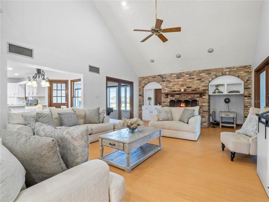 Fireplace, Interior, Kitchen, Living room, Pendant Lights, Recessed Lighting, Stone Walls, Wood Texture Flooring