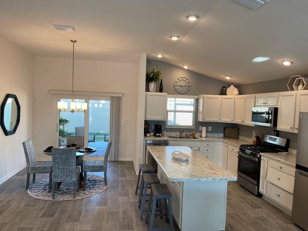 Dining room, Interior, Kitchen, Pendant Lights, Recessed Lighting, Water, Wood Texture Flooring