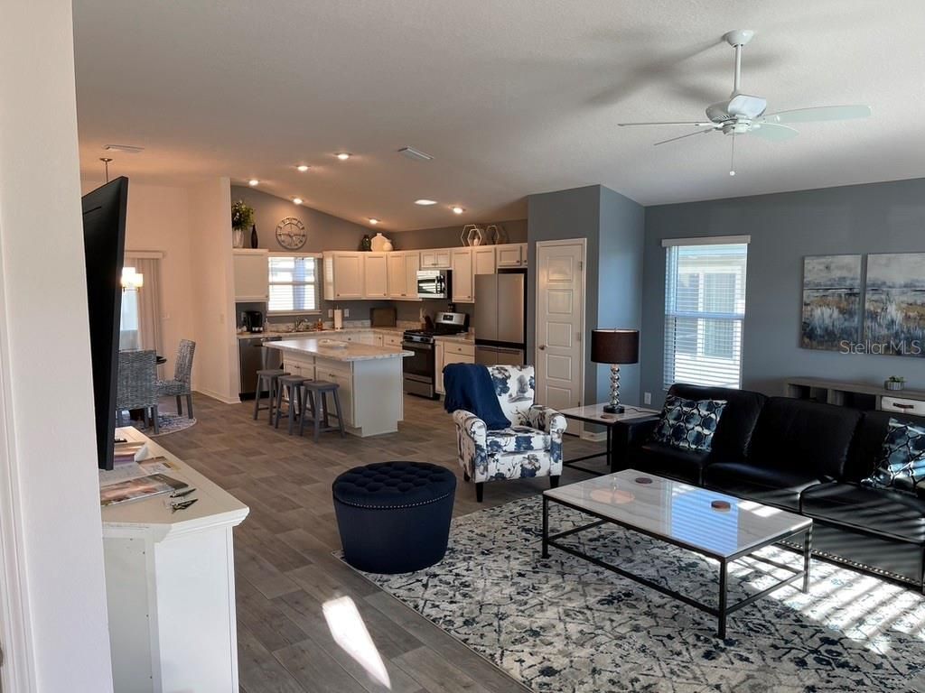 Dining room, Interior, Kitchen, Living room, Recessed Lighting, Stainless Steel Appliances, Wood Texture Flooring