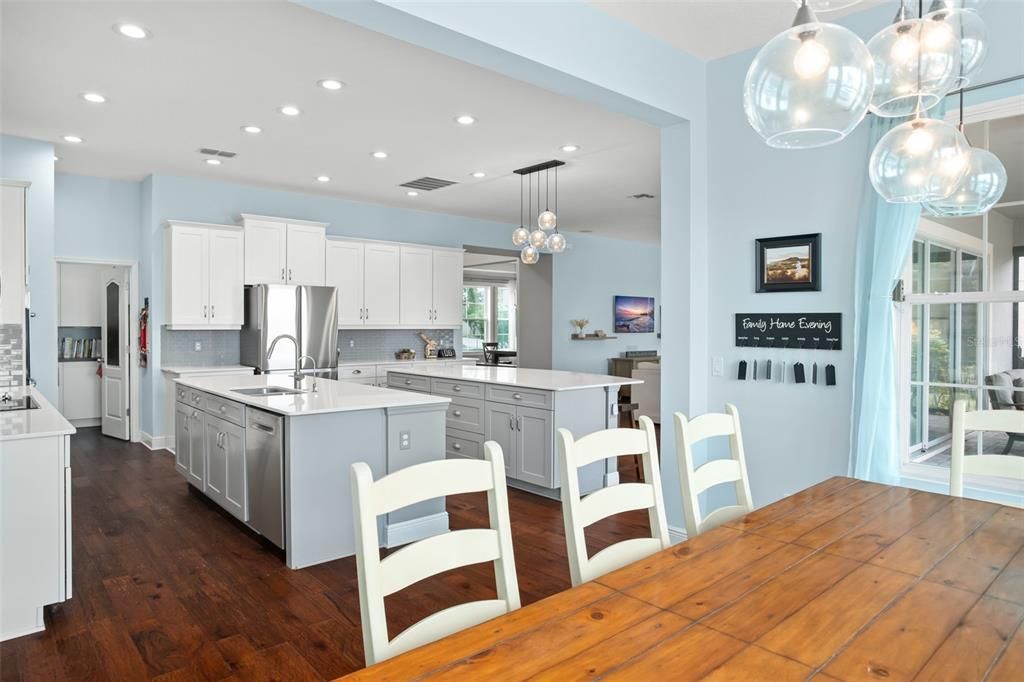 Dining room, Interior, Kitchen, Pendant Lights, Recessed Lighting, Stainless Steel Appliances, Wood Texture Flooring