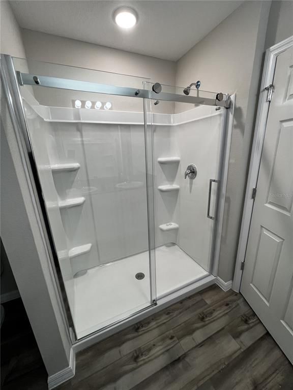 Bathroom, Glass Shower, Interior, Recessed Lighting, Wood Texture Flooring