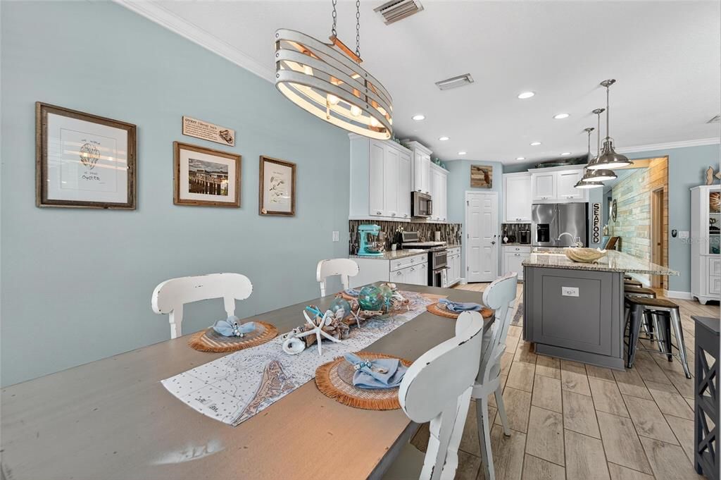 Dining room, Interior, Kitchen, Pendant Lights, Recessed Lighting, Stainless Steel Appliances, Wood Texture Flooring