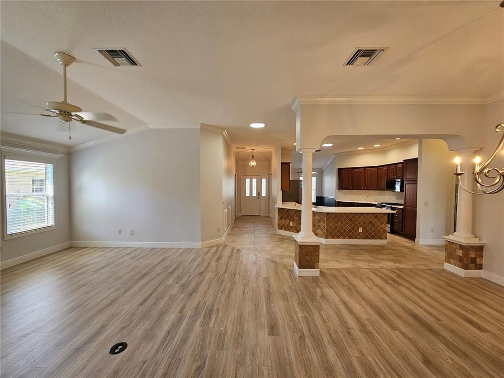 Empty room, Interior, Kitchen, Pendant Lights, Recessed Lighting, Stainless Steel Appliances, Wood Texture Flooring