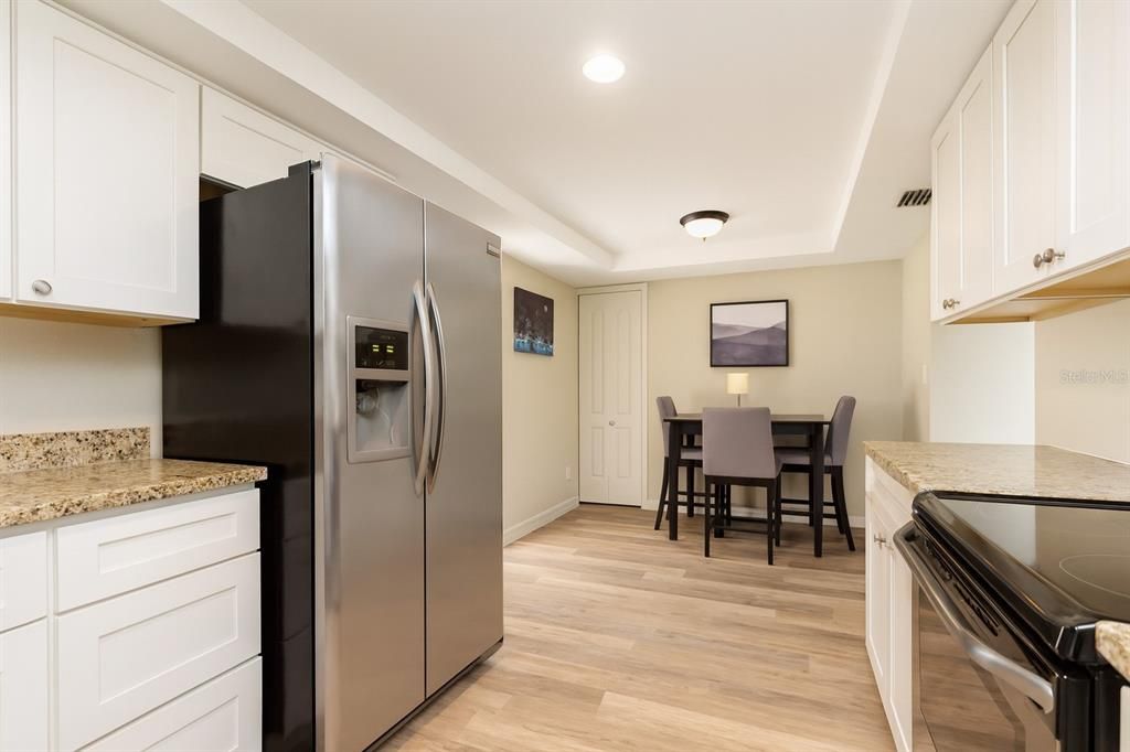 Dining room, Interior, Kitchen, Recessed Lighting, Stainless Steel Appliances, Wood Texture Flooring