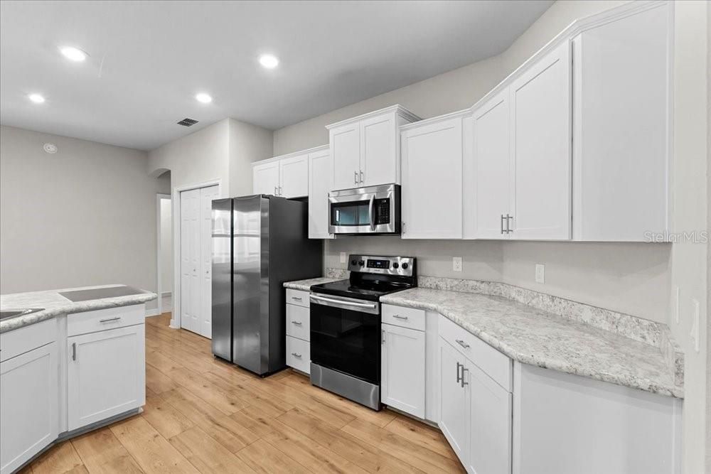 Interior, Kitchen, Recessed Lighting, Stainless Steel Appliances, Wood Texture Flooring