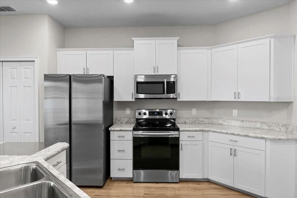 Interior, Kitchen, Recessed Lighting, Stainless Steel Appliances, Wood Texture Flooring