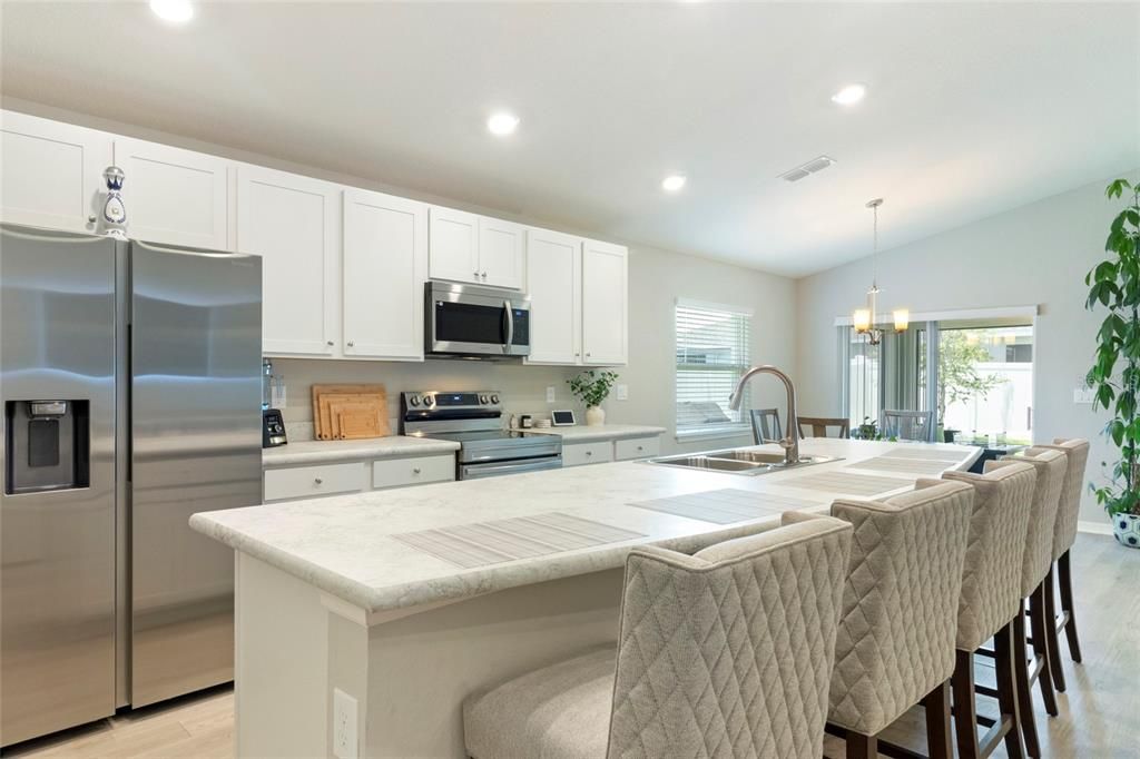 Chandelier, Interior, Kitchen, Pendant Lights, Recessed Lighting, Stainless Steel Appliances, Wood Texture Flooring