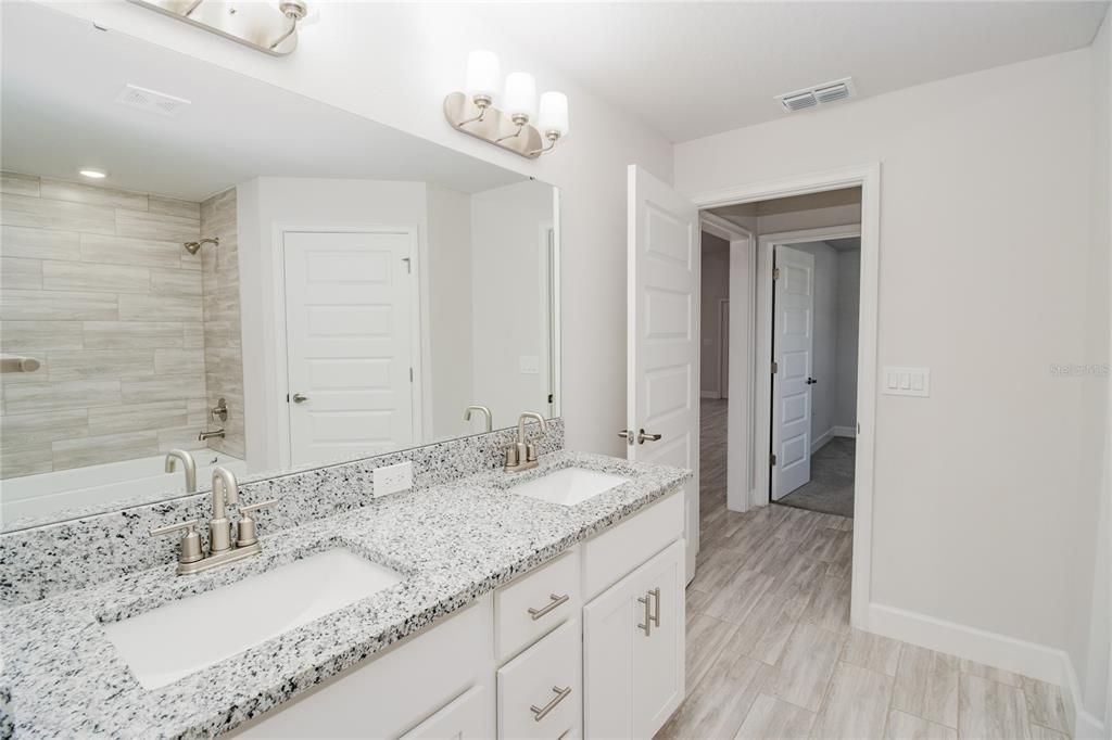 Bathroom, Dual Sink Vanities, Interior, Recessed Lighting, Wood Texture Flooring