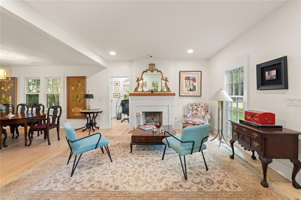 Dining room, Fireplace, Interior, Living room, Recessed Lighting, Wood Texture Flooring