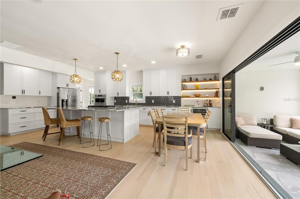 Dining room, Interior, Kitchen, Pendant Lights, Recessed Lighting, Stainless Steel Appliances, Wood Texture Flooring