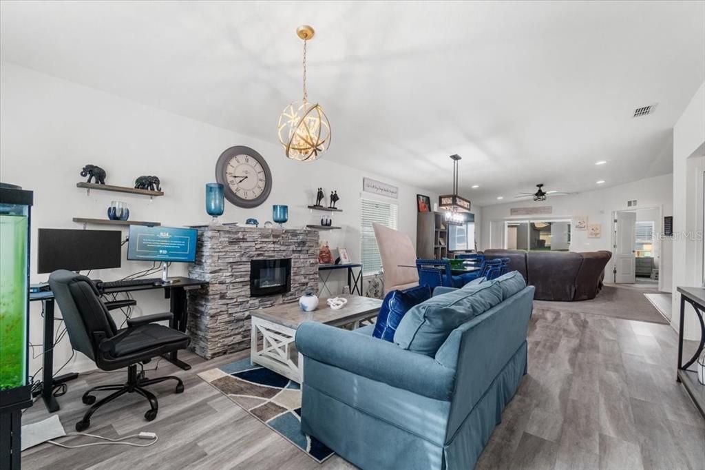 Fireplace, Home Office, Interior, Living room, Pendant Lights, Recessed Lighting, Stone Walls, Wood Texture Flooring