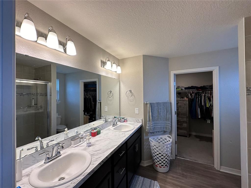 Bathroom, Dual Sink Vanities, Glass Shower, Interior, Walk-in Closets, Wood Texture Flooring
