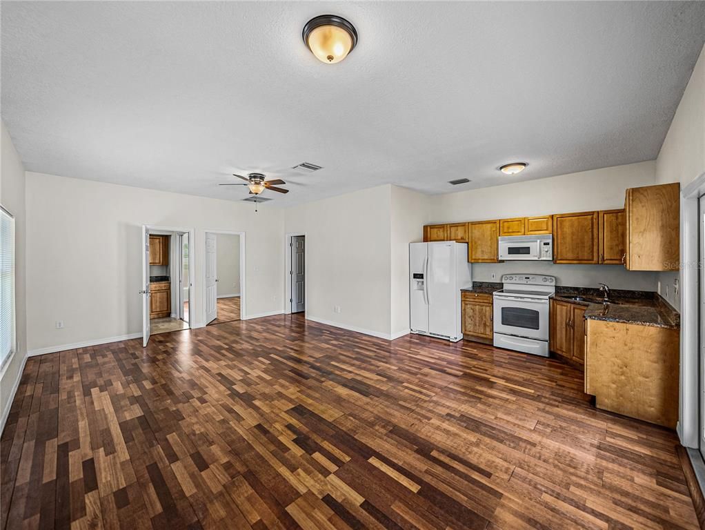 Empty room, Interior, Kitchen, Stainless Steel Appliances, Wood Texture Flooring
