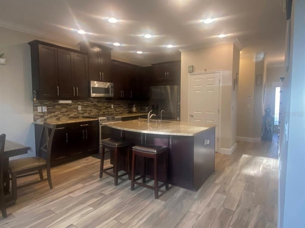 Interior, Kitchen, Recessed Lighting, Stainless Steel Appliances, Wood Texture Flooring