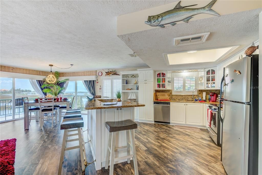 Dining room, Interior, Kitchen, Pendant Lights, Stainless Steel Appliances, Wood Texture Flooring