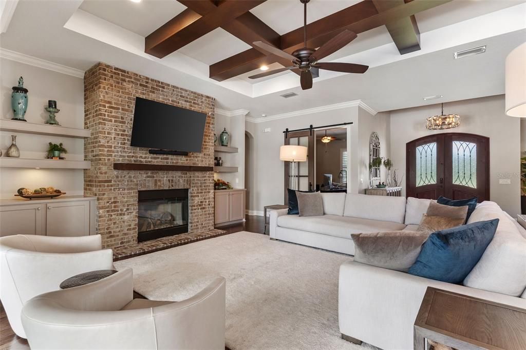 Chandelier, Fireplace, Interior, Living room, Pendant Lights, Recessed Lighting, Stone Walls, Wooden Beams