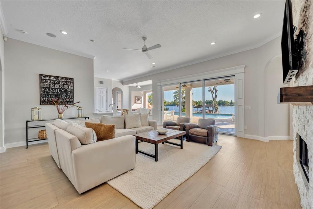 Fireplace, Interior, Living room, Recessed Lighting, Water, Wood Texture Flooring