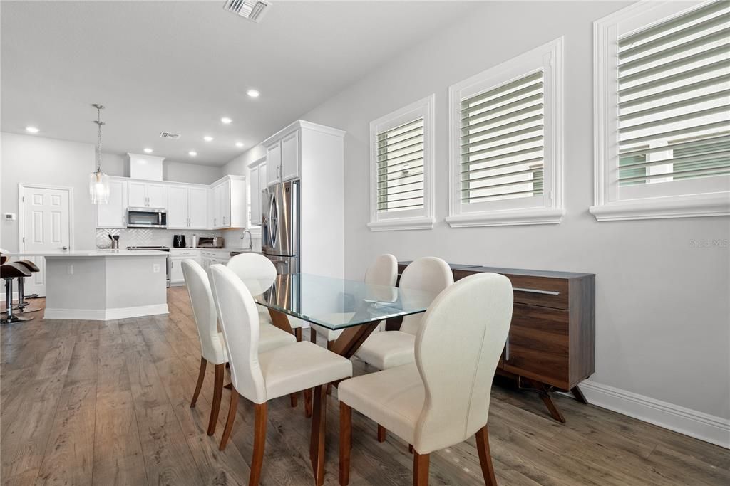 Dining room, Interior, Kitchen, Pendant Lights, Recessed Lighting, Stainless Steel Appliances, Wood Texture Flooring