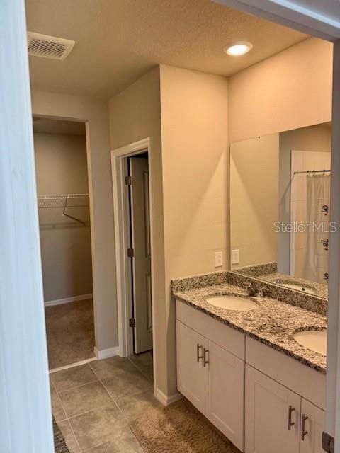 Bathroom, Dual Sink Vanities, Interior, Recessed Lighting, Walk-in Closets