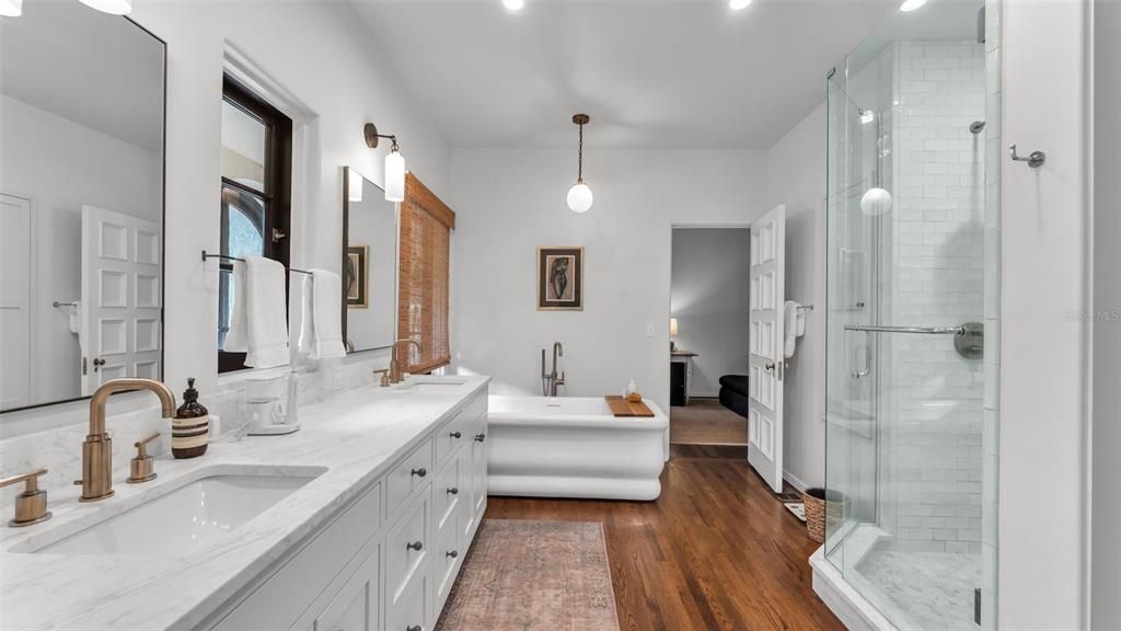 Bathroom, Dual Sink Vanities, Free Standing Baths, Glass Shower, Interior, Pendant Lights, Recessed Lighting, Wood Texture Flooring